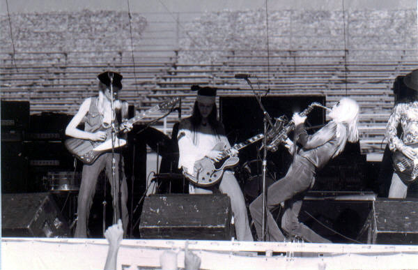 Photos taken during the 1976 Together tour, showing Johnny & Edgar Winter together with their band-members live on stage.